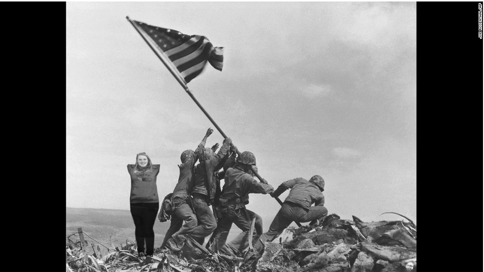 U.S. Marines of the 28th Regiment, 5th Division, raise the American flag atop Mt. Suribachi, Iwo Jima, on Feb. 23, 1945. Strategically located only 660 miles from Tokyo, the Pacific island became the site of one of the bloodiest, most famous battles of World War II against Japan.  (AP Photo/Joe Rosenthal)